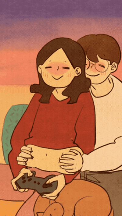 Man Hugging Woman Holding Controller GIF