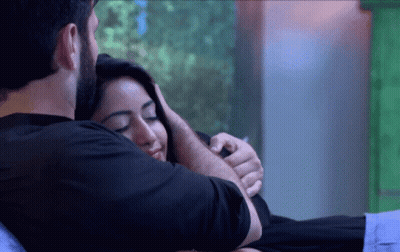 Man Hugging Woman On Bed GIF
