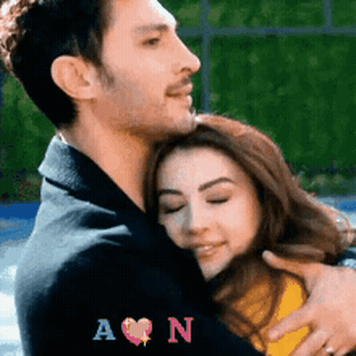 Man Hugging Woman With Initials A And N GIF