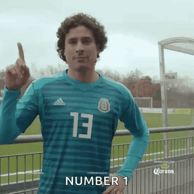 Man In #13 Jersey Pointing Up GIF