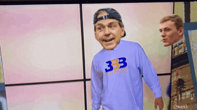 Man In 333 Shirt Stands In Front Of Another Man GIF