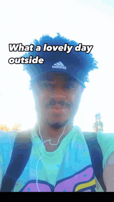 Man In Adidas Hat And Ear Buds GIF