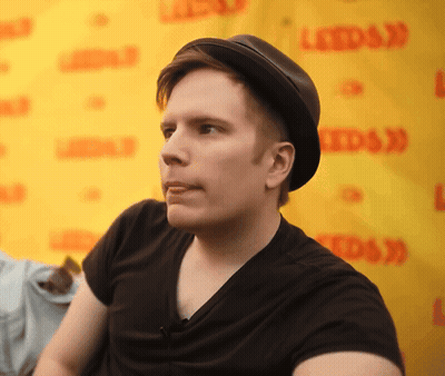 Man In Adidas Jacket In Front Of Boost Drinks Sign GIF