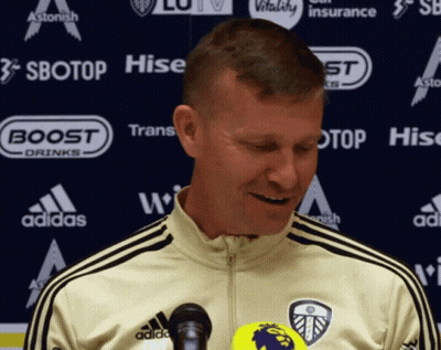 Man In Adidas Jacket In Front Of Sbotop And Hise Advertisement GIF