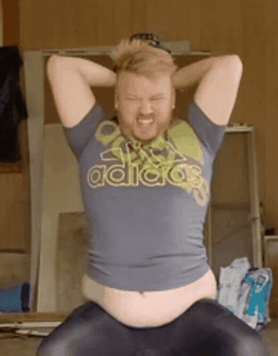 Man In Adidas Shirt Sitting With Hands On Head GIF