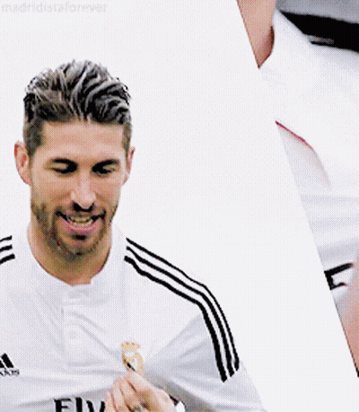 Man In Adidas Shirt Smiling Holding Something GIF