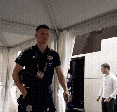 Man In Adidas Shirt With Scotland Badge GIF