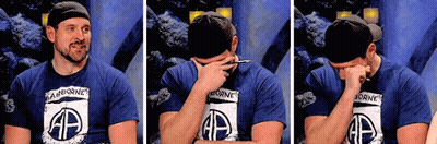Man In Airborne Shirt Covering Face GIF