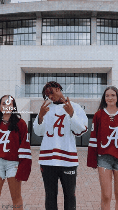 Man In Alabama Hockey Jersey With Two Women GIF
