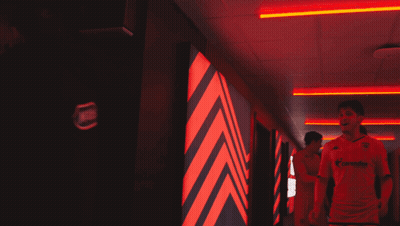 Man In Allianz Jersey Walking Down Hallway GIF