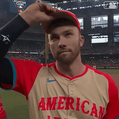 Man In American Baseball Jersey Adjusts Cap GIF