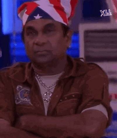 Man In American Flag Bandana Looking At Camera GIF