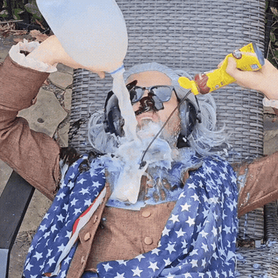 Man In American Flag Outfit Being Poured Milk GIF