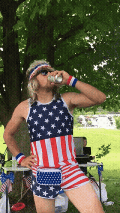 Man In American Flag Tank Top Drinking GIF