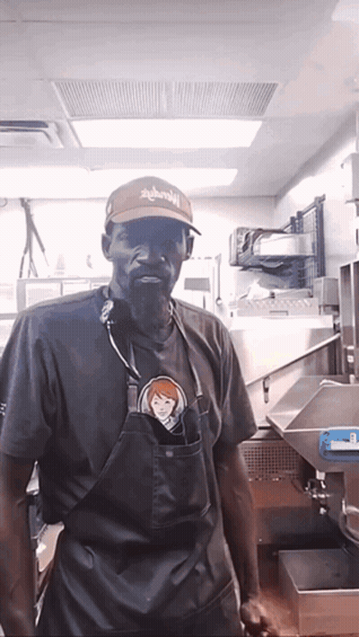 Man In Apron And Hat Saying Wendy's GIF