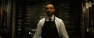 Man In Apron At Mean Bean Menu GIF
