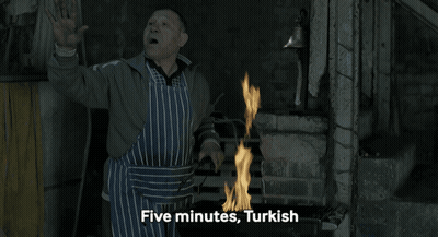 Man In Apron By Fire Saying Five Minutes Turkish GIF