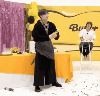 Man In Apron Holding Wine Bottle GIF