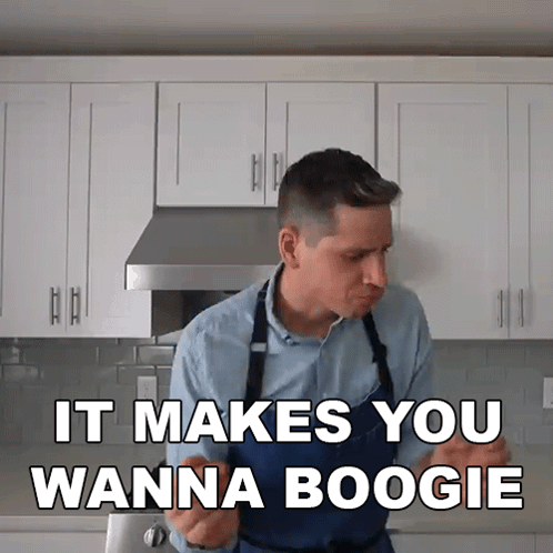 Man In Apron In Kitchen Says It Makes You Wanna Boogie GIF