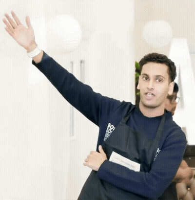 Man In Apron Saying Bo Waving GIF