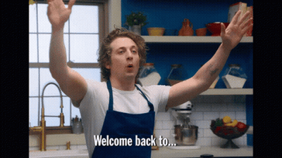 Man In Apron Says Welcome Back To GIF