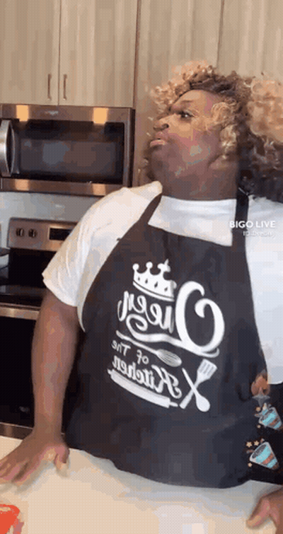 Man In Apron Standing In Kitchen GIF