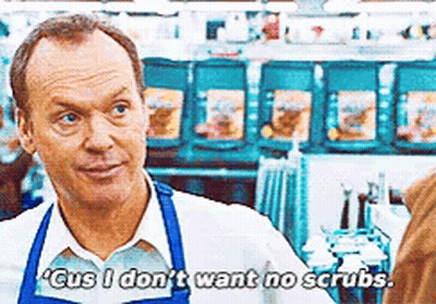 Man In Apron Talking To Another Man In Store GIF