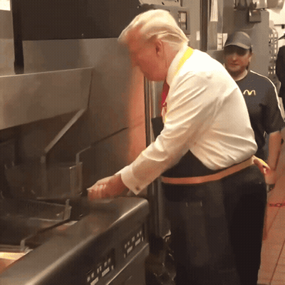 Man In Apron With M Cooking GIF