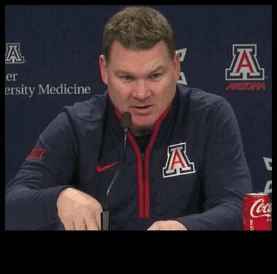 Man In Arizona Jacket Talking Into Microphone GIF