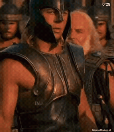 Man In Armor And Helmet Standing Before Crowd GIF