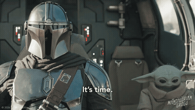 Man In Armor Holding Baby Says I Guess You Sit Right Here GIF