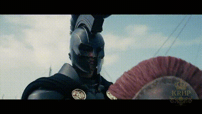 Man In Armor Holding Red Feathered Helmet GIF