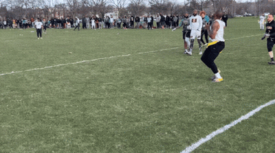 Man In Armor Holding Shield And Axe On Sidewalk GIF