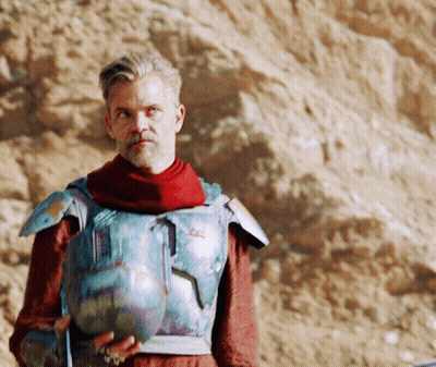 Man In Armor Holding Vase GIF