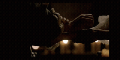 Man In Armor Kneeling With Hands On Chest GIF