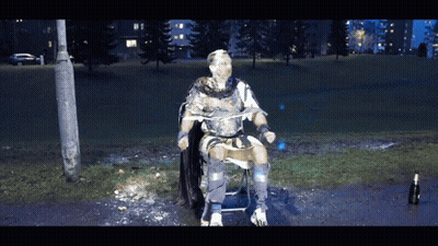 Man In Armor Sitting With Ice-Covered Face GIF