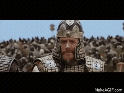 Man In Armor Standing Before Crowd GIF