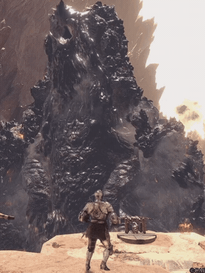 Man In Armor Standing Before Large Rock Formation GIF