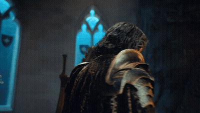 Man In Armor Standing By Window With Shield GIF