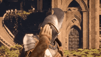 Man In Armor Touching Helmet In Front Of Building GIF