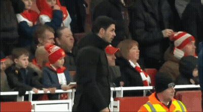 Man In Arsenal Hat In Front Of Crowd GIF