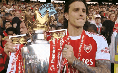 Man In Arsenal Jersey Holding Trophy GIF