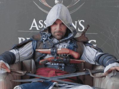 Man In Assassin's Creed Costume Holding Swords GIF