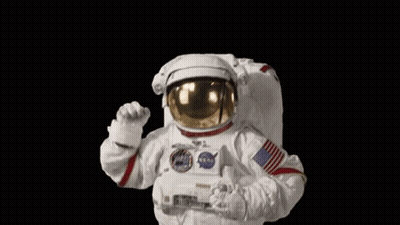 Man In Astronaut Suit Waving Fist GIF