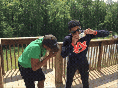 Man In Auburn Sweatshirt Drinking From Bottle GIF