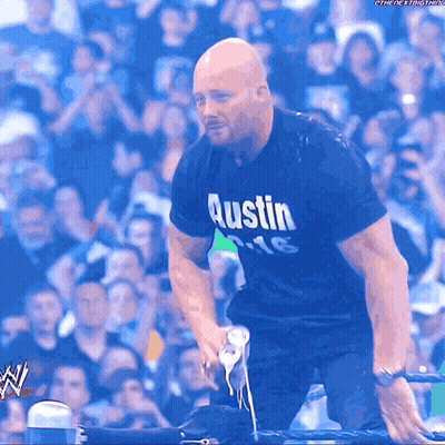 Man In Austin Shirt Kneeling Down GIF