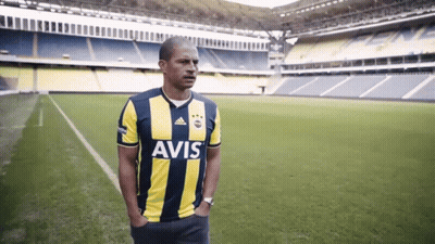 Man In Avis Jersey In Front Of Soccer Field GIF