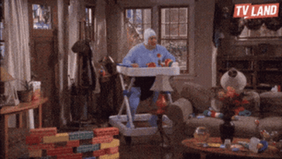 Man In Baby Costume Sitting In High Chair GIF