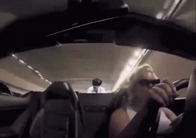 Man In Back Seat Of Airplane Woman In Front GIF