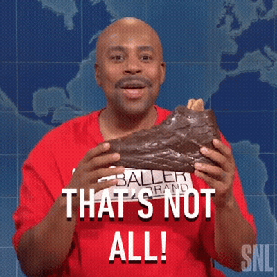 Man In Baller Brand Shirt Holding Chocolate Shoe GIF